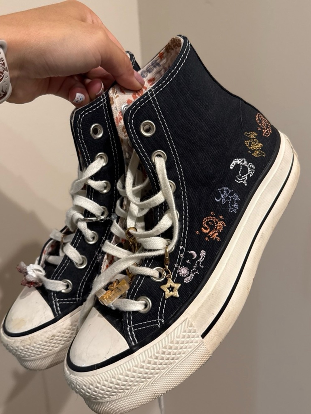 Black High-Top Converse Sneakers with Star Signs